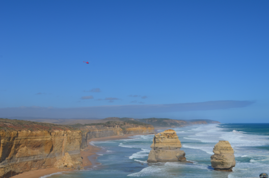 Great Ocean Road - Red heli flying over the Great Ocean Road